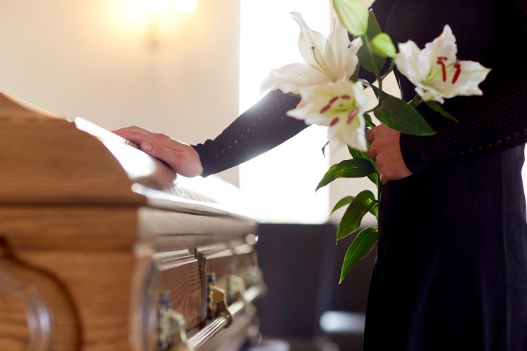Image of a person at a funeral.