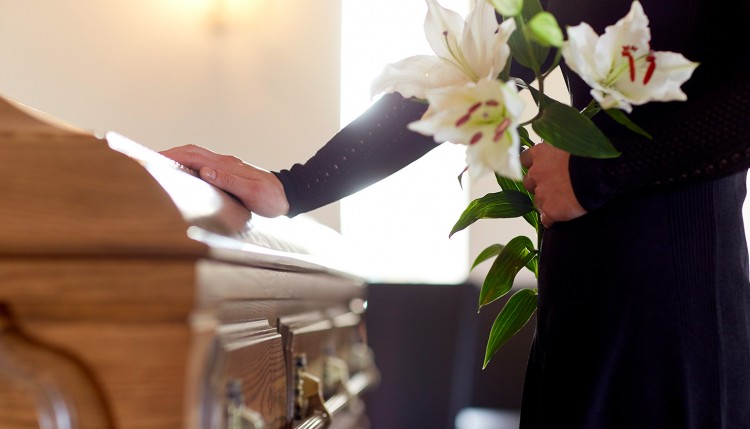 Image of a person at a funeral.